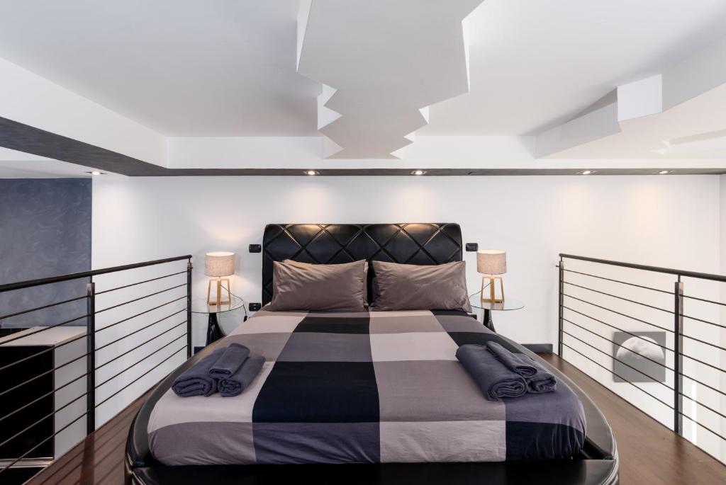 Postel nebo postele na pokoji v ubytování Porta Susa - Liberty Loft