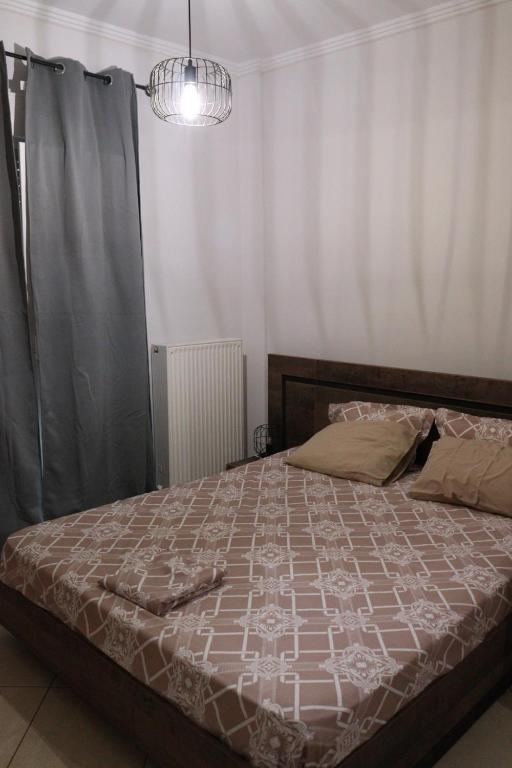 Posteľ alebo postele v izbe v ubytovaní όμορφο διαμέρισμα με αυλή