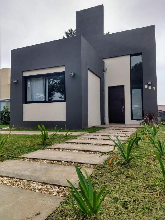 a black and white house with a driveway at Morada del Mar in Mar de Cobo