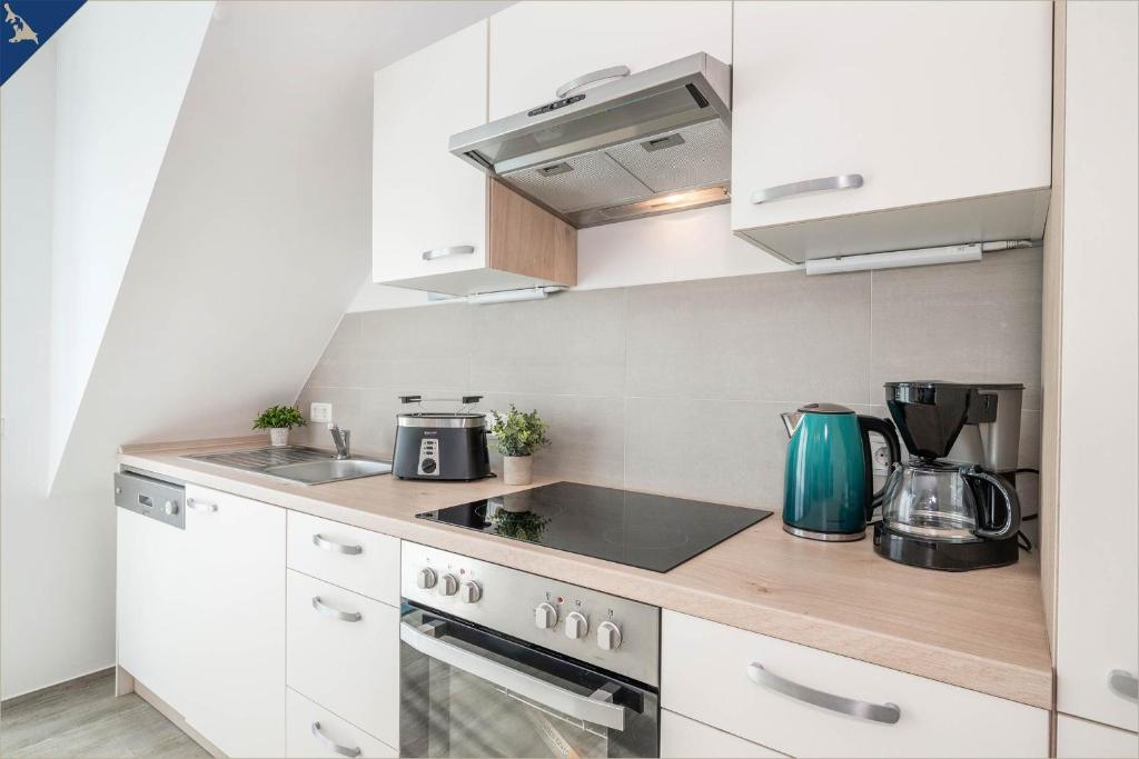 Kuchyň nebo kuchyňský kout v ubytování Ferienanlage Sonneninsel Haus Himmelblau Obergeschoss