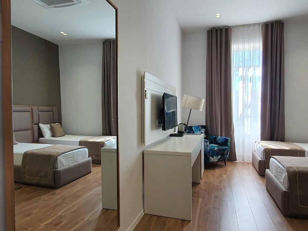 Postel nebo postele na pokoji v ubytování HEIRESS Hotel