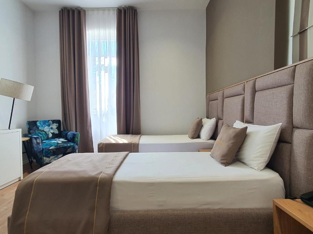 Postel nebo postele na pokoji v ubytování HEIRESS Hotel