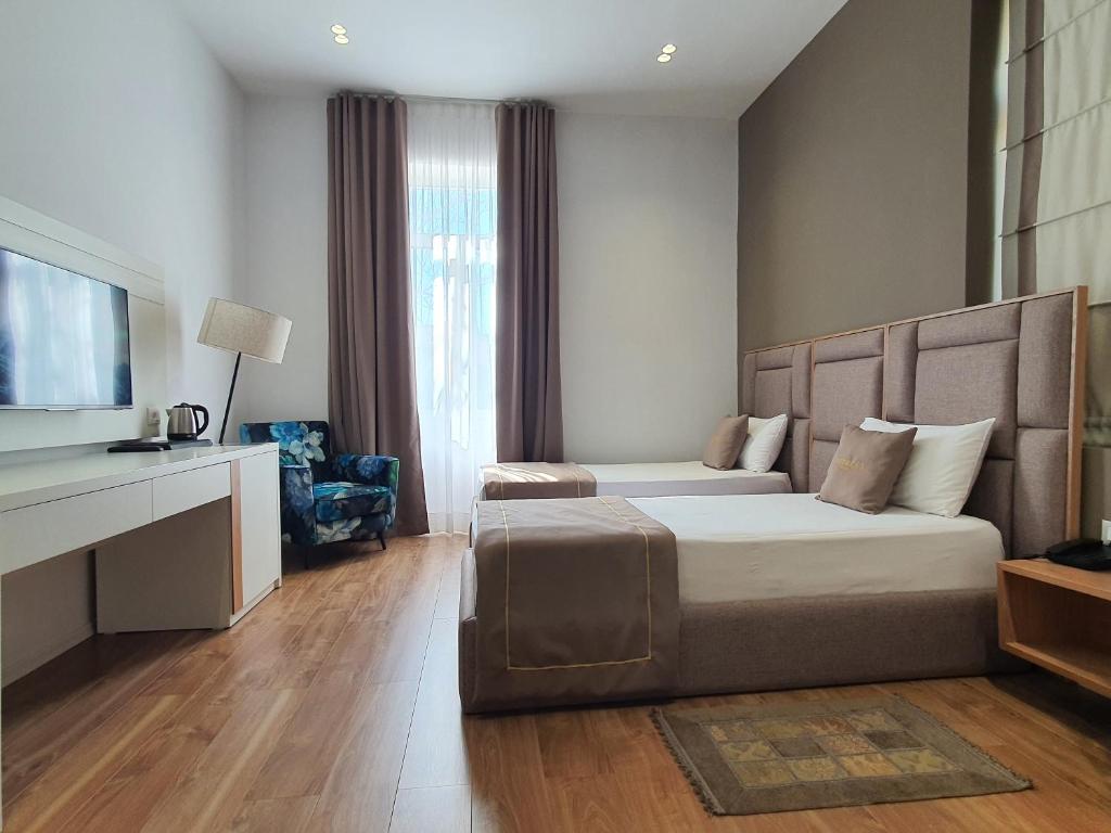 TV a/nebo společenská místnost v ubytování HEIRESS Hotel