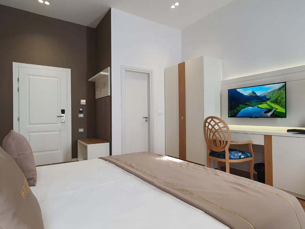 Postel nebo postele na pokoji v ubytování HEIRESS Hotel