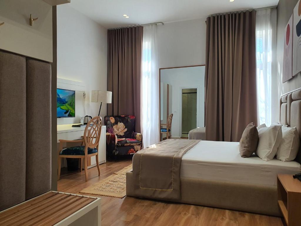 Postel nebo postele na pokoji v ubytování HEIRESS Hotel