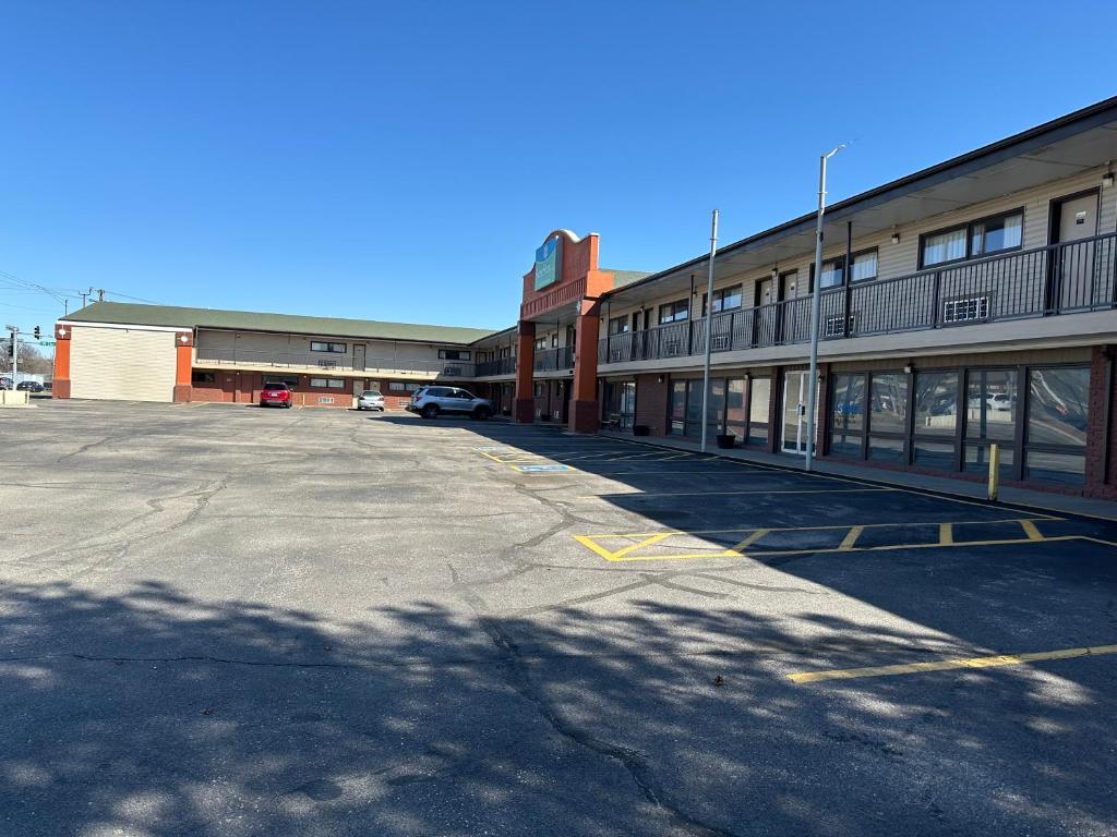 an empty parking lot in front of a building at Stay Inn by OYO Near I 80 Lincoln West in Lincoln