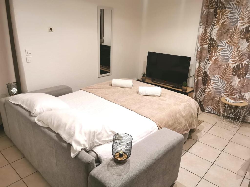 Postel nebo postele na pokoji v ubytování Maison Time Break Jacuzzi - 4 étoiles