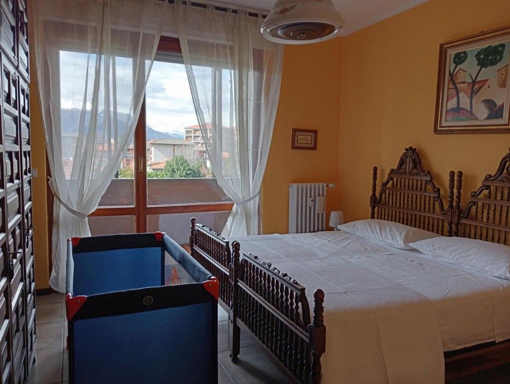 En eller flere senge i et værelse på Appartamento Aurora