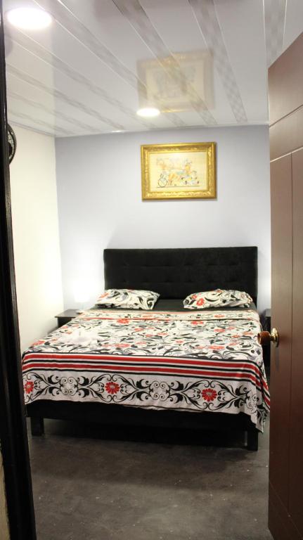 Postel nebo postele na pokoji v ubytování Hostal Queens Deluxe