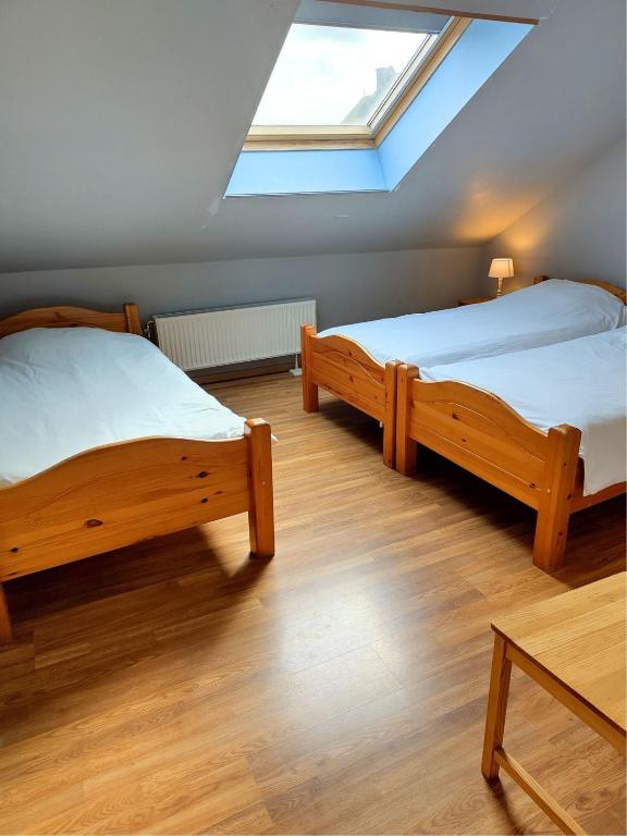 Postel nebo postele na pokoji v ubytování La Ferme Oubliée