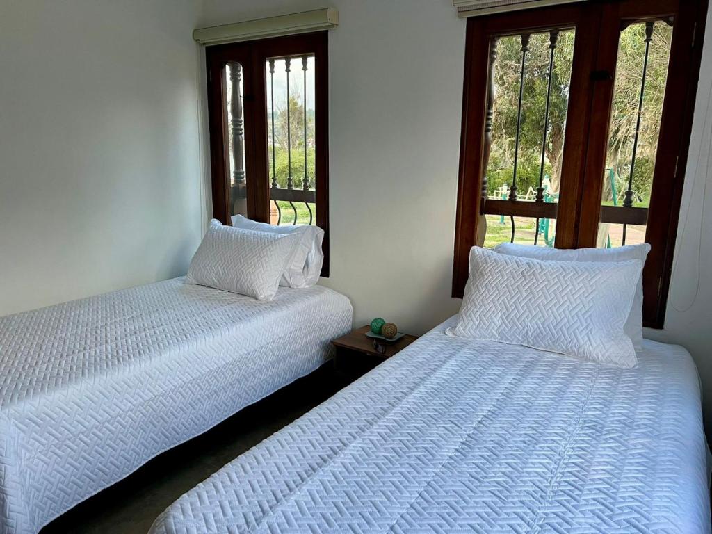Postel nebo postele na pokoji v ubytování Casa Akuaina