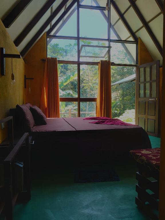 Postel nebo postele na pokoji v ubytování Rainforest cabin