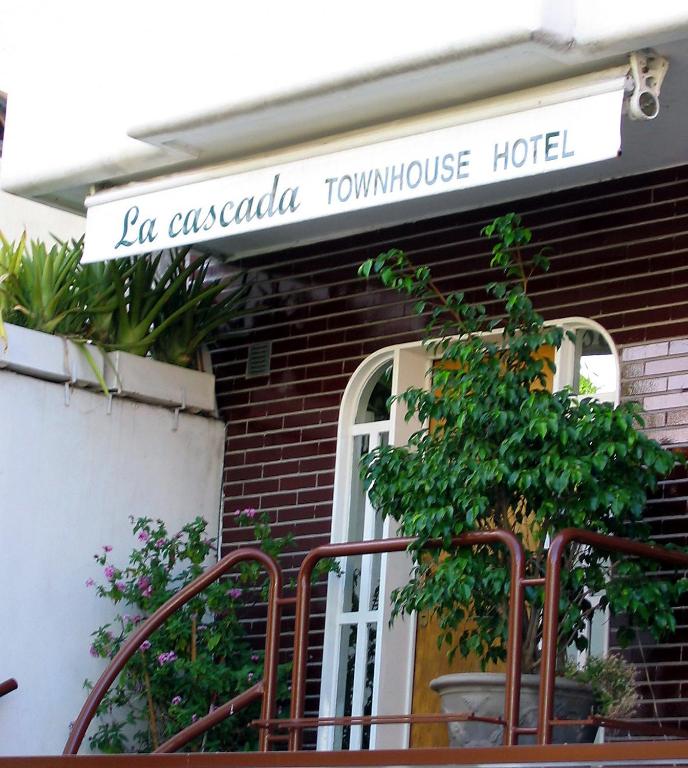 a sign that reads la escobar town house hotel at La Cascada Townhouse Hotel in Buenos Aires