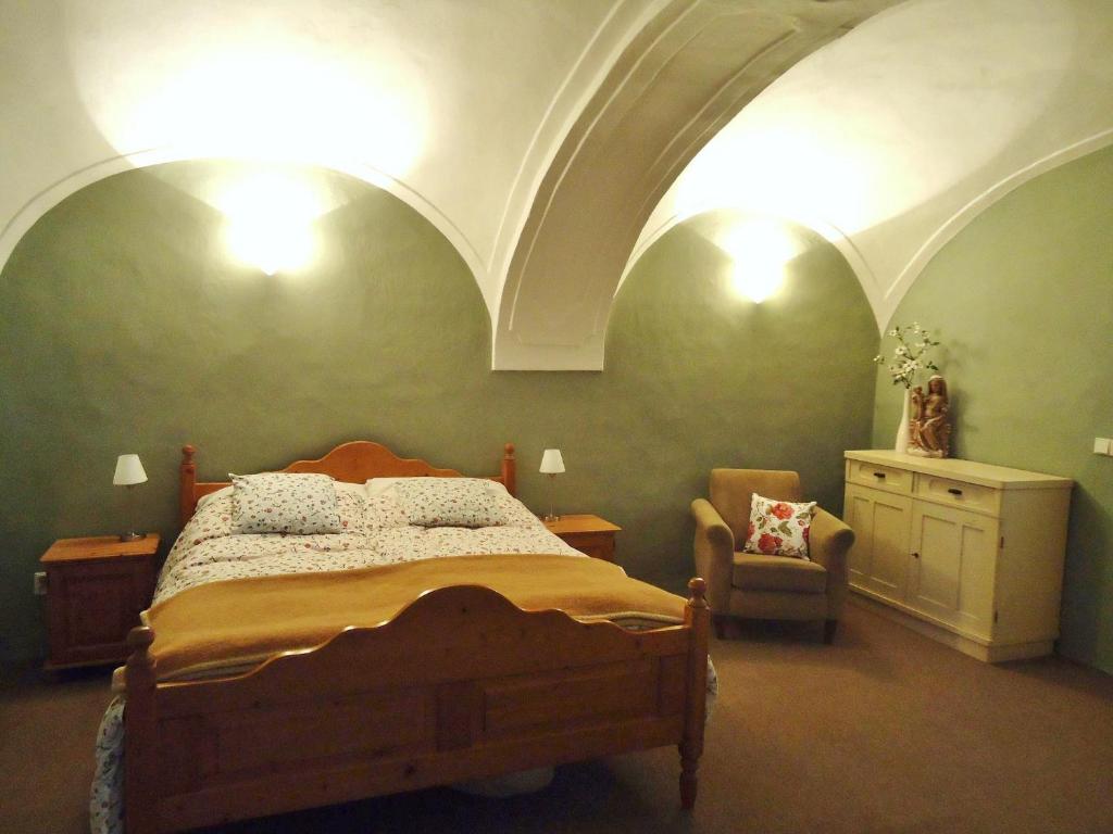 A bed or beds in a room at U Jablka