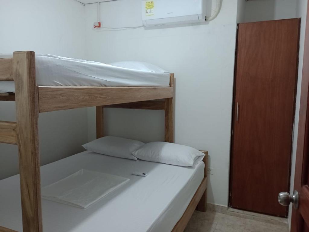 Postel nebo postele na pokoji v ubytování Apartamentos Poseidon