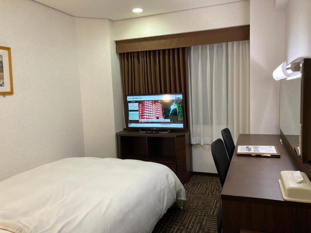 TV a/nebo společenská místnost v ubytování Hotel Alpha-One Yamaguchi Inter