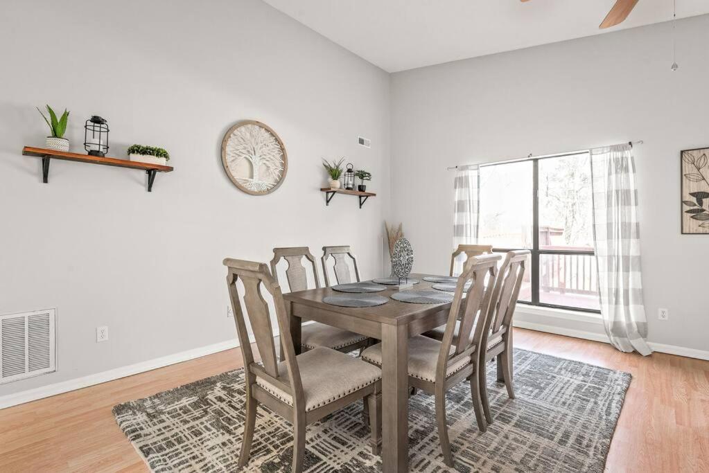 a dining room with a table and chairs at Renovated 3BR Retreat with Large Patio & Grill in Charlotte