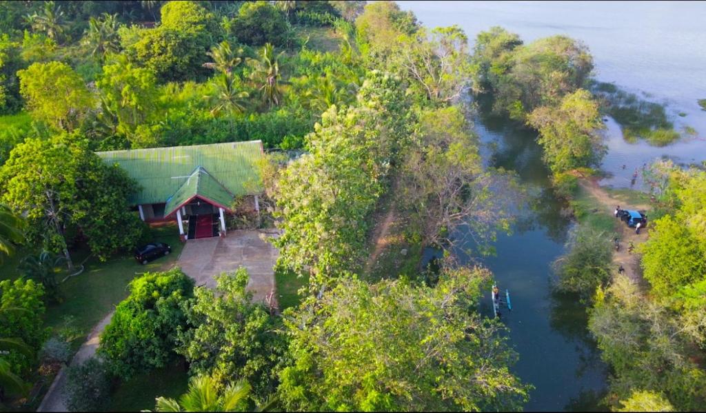 an aerial view of a house in the middle of a river at Elegant Riverside Resort in Dematapelessa