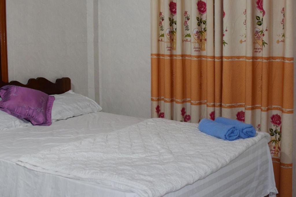 Postel nebo postele na pokoji v ubytování Phong Nha Backpacker Hostel