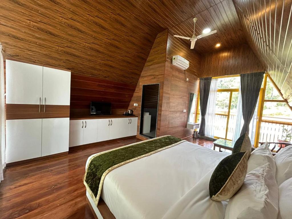 Postel nebo postele na pokoji v ubytování Suvarna Eco Village