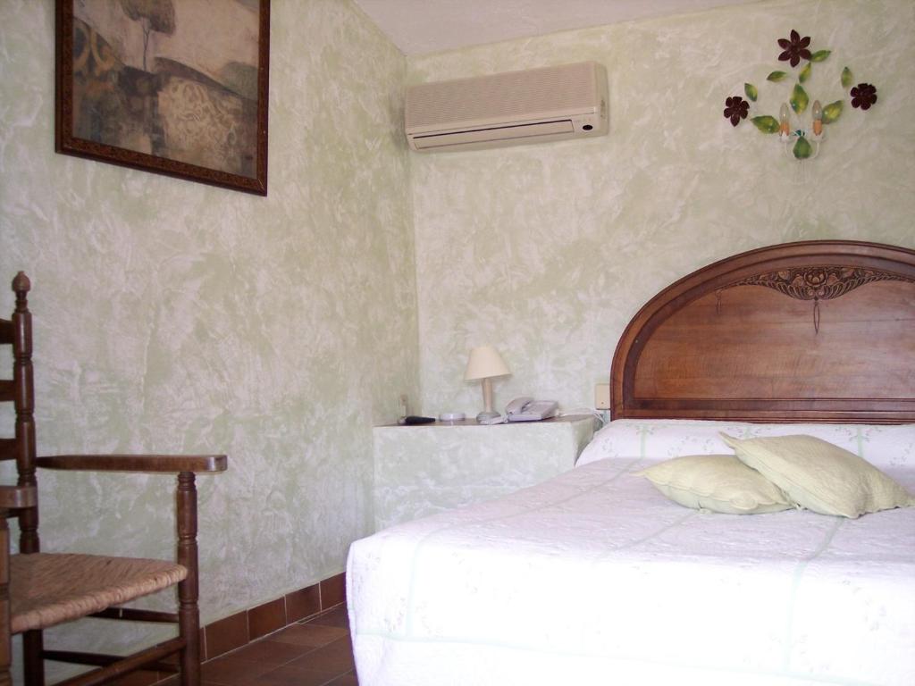 Postel nebo postele na pokoji v ubytování La Pierrerie