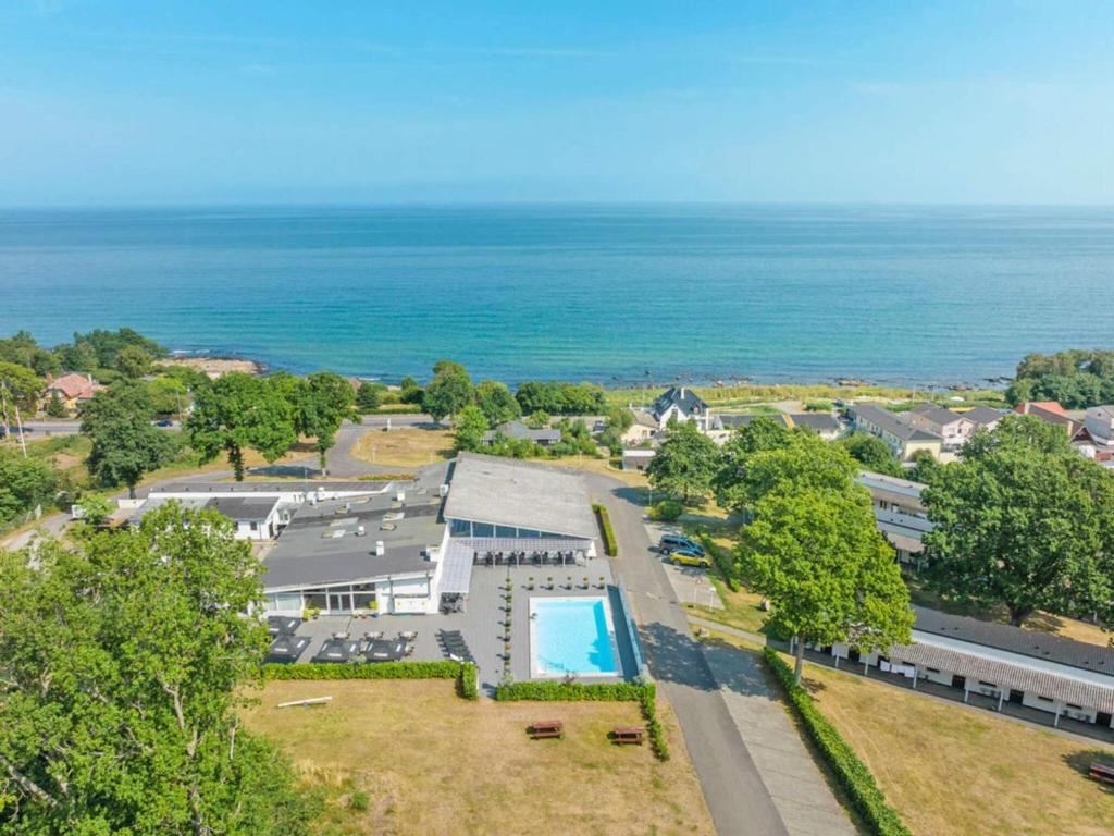 an aerial view of a house with a swimming pool and the ocean at 2 person holiday home in Allinge in Allinge