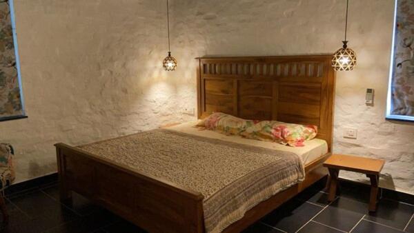 Кровать или кровати в номере Bhajan Kala Cottage