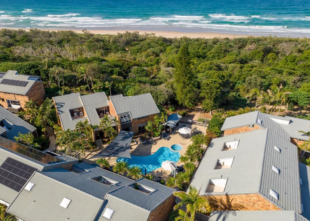 an aerial view of the house and the beach at Glen Eden Beach Resort in Peregian Beach