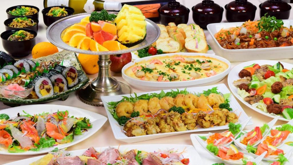 a table full of different types of food at Iroha Grand Hotel Kintetsu Nara Ekimae in Nara