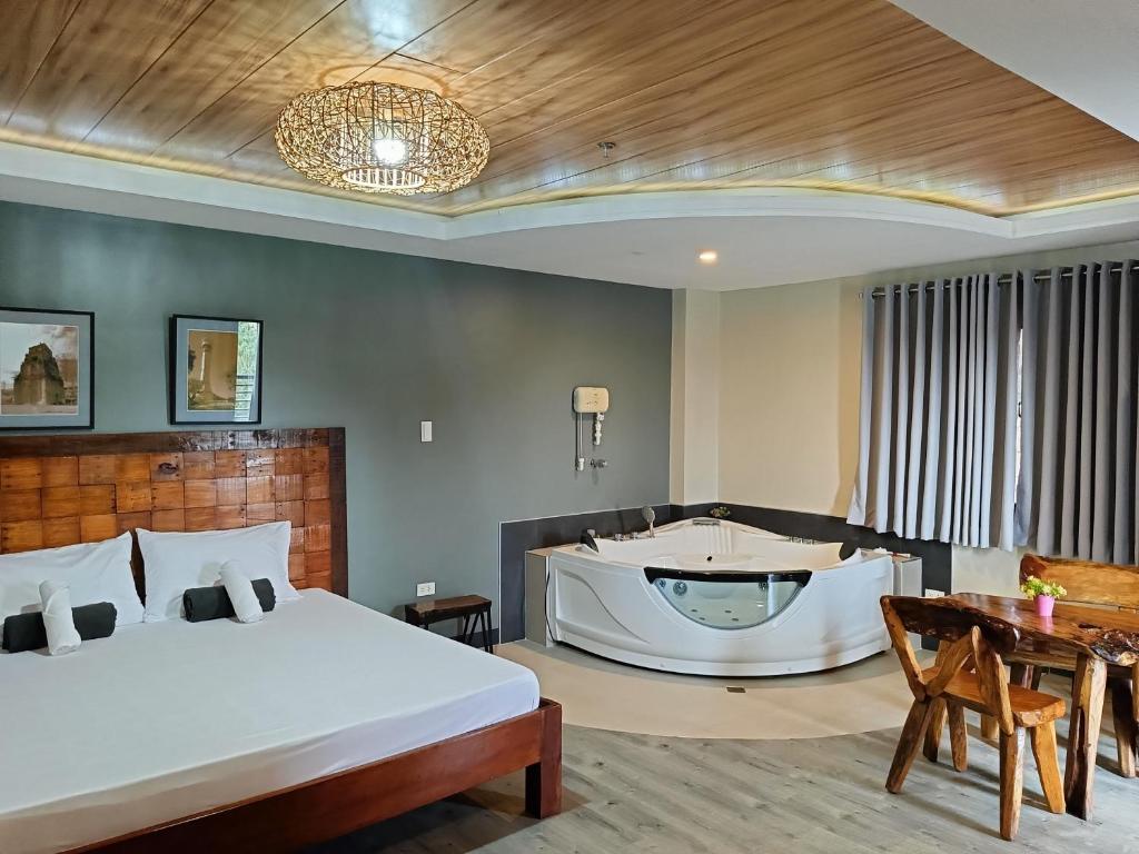 Postel nebo postele na pokoji v ubytování Norlu Cedec Midpoint Hotel