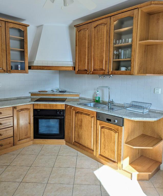 Kuchyň nebo kuchyňský kout v ubytování Apartment Fragola