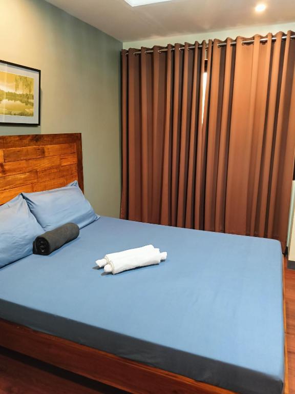 Postel nebo postele na pokoji v ubytování Norlu Cedec Midpoint Hotel