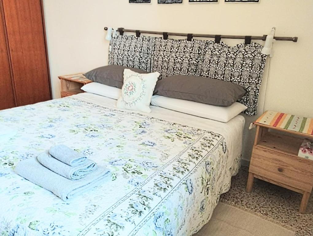 a bedroom with a bed with towels on it at Private room and bathroom close to Piazzale Roma in Venice Mestre in Mestre