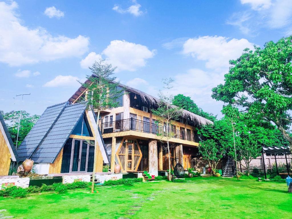 a house with a solar roof on top of it at Moc Villa - Venuestay in Hanoi