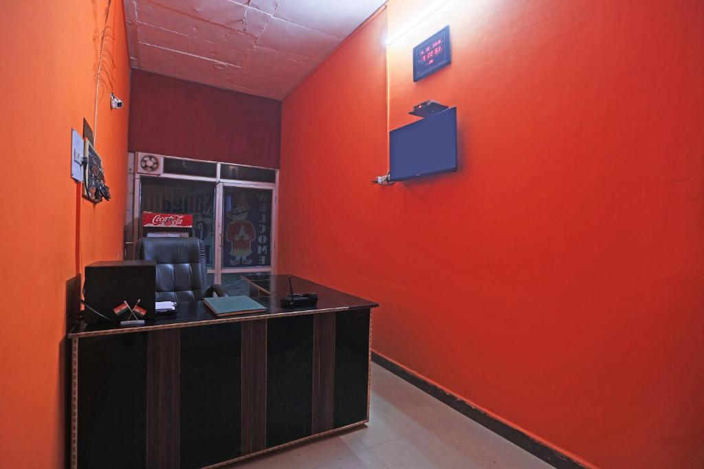 Televiisor ja/või meelelahutuskeskus majutusasutuses Sangam Guest House