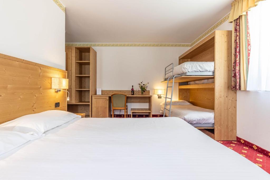 Postel nebo postele na pokoji v ubytování Hotel Plank