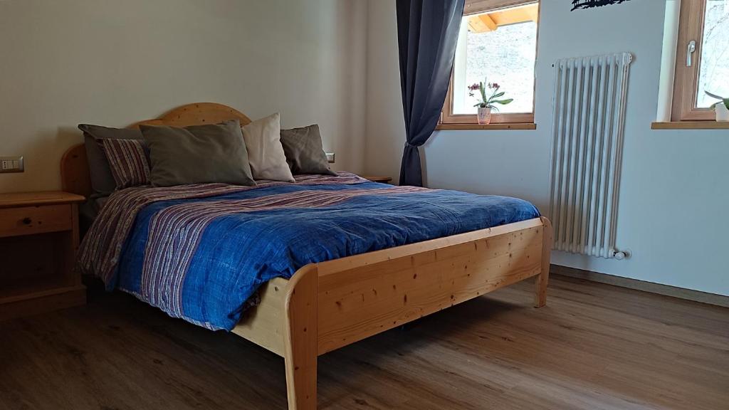 Postel nebo postele na pokoji v ubytování Ai Monti