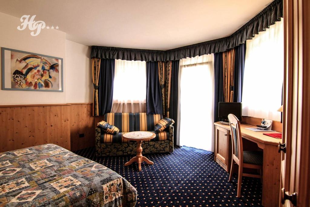 Postel nebo postele na pokoji v ubytování Hotel Plank