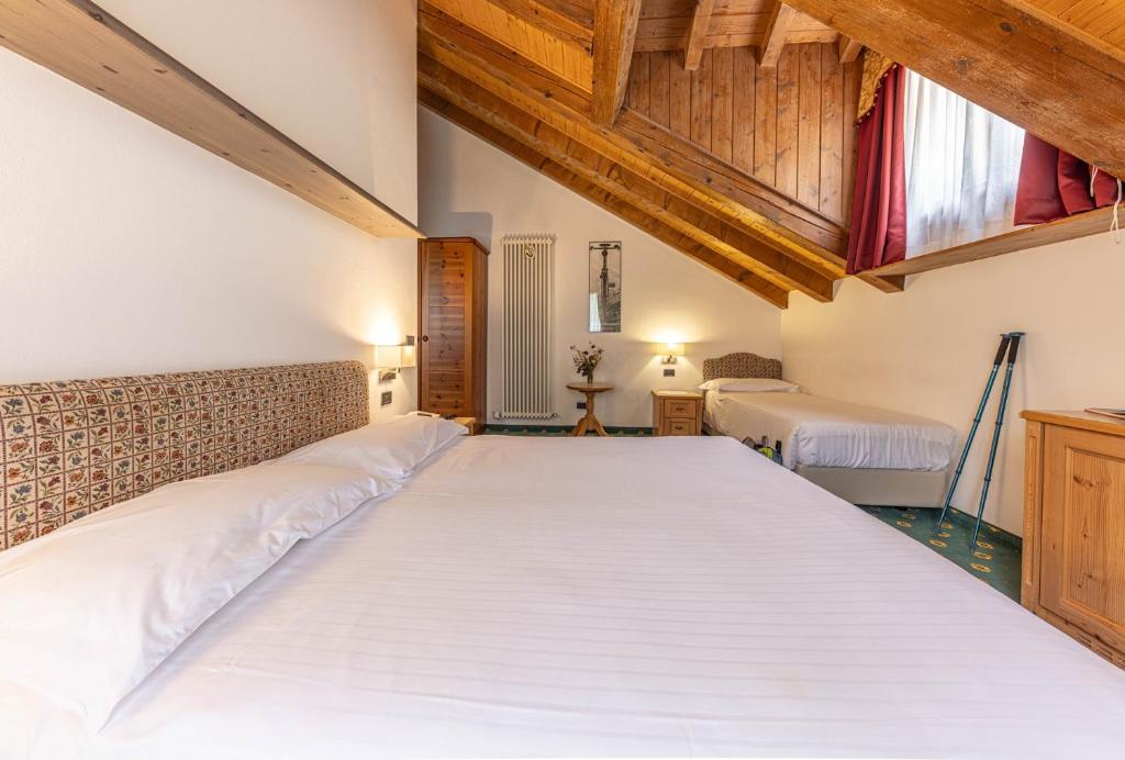 Postel nebo postele na pokoji v ubytování Hotel Plank
