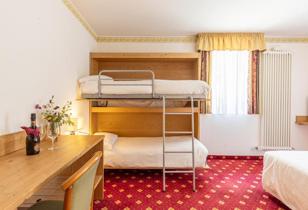 Postel nebo postele na pokoji v ubytování Hotel Plank