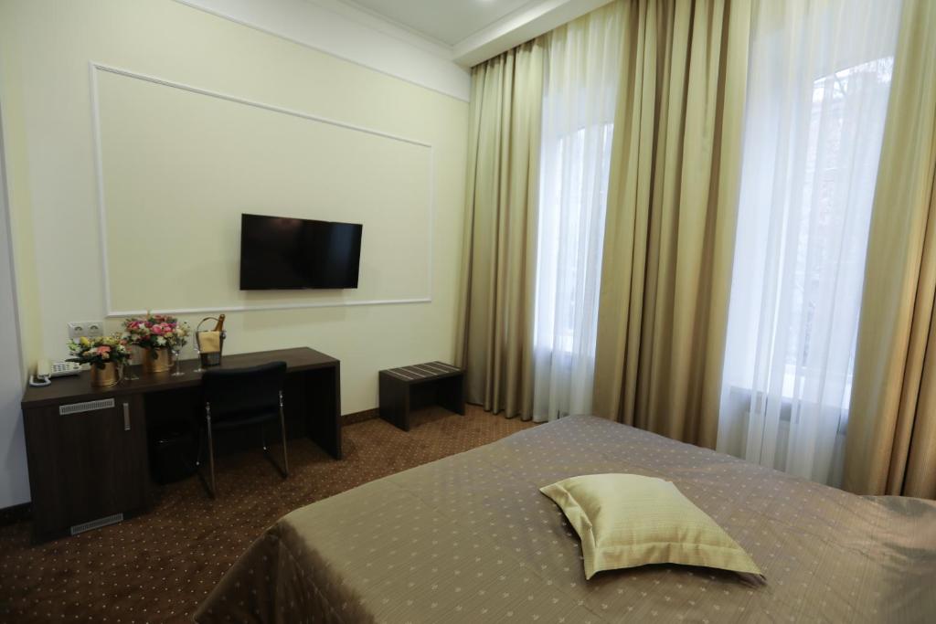 Postel nebo postele na pokoji v ubytování Hotel Donald