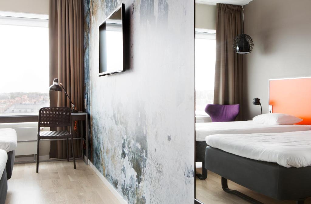 Postel nebo postele na pokoji v ubytování Comfort Hotel Winn