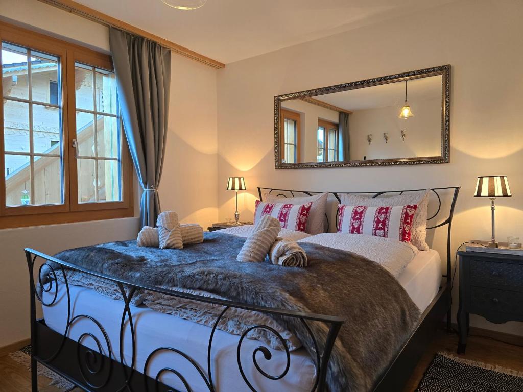 a bedroom with a bed with a mirror on the wall at Mountain Lodge *Nature *Queen Beds *Free parking in Oberwil