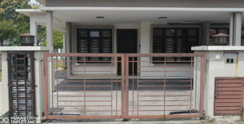a house with a gate in front of it at AR RAYYAN Homestay Banting in Banting