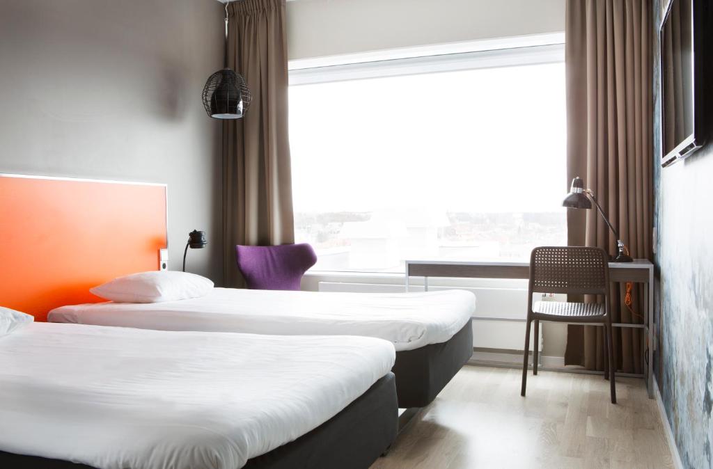 Postel nebo postele na pokoji v ubytování Comfort Hotel Winn