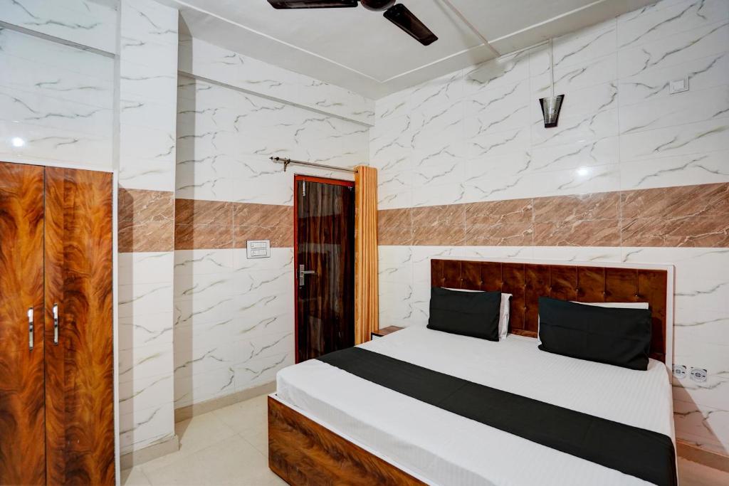 Postel nebo postele na pokoji v ubytování Np Ji Hotel