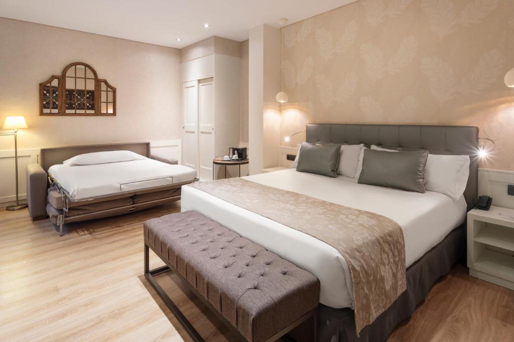 Cama o camas de una habitación en Catalonia Puerta del Sol