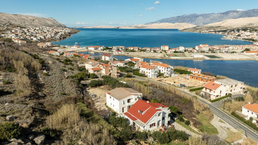 an aerial view of a town next to a body of water at Barba Damir in Pag