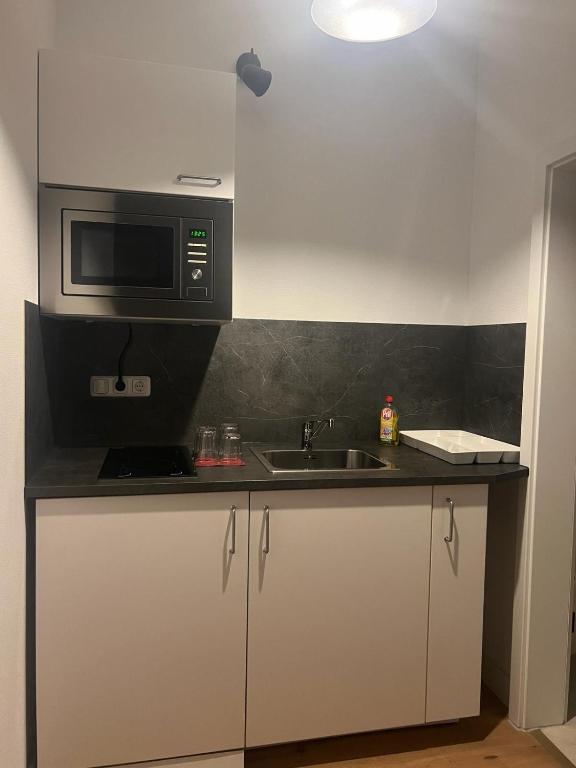Kuchyň nebo kuchyňský kout v ubytování Hotel Soers