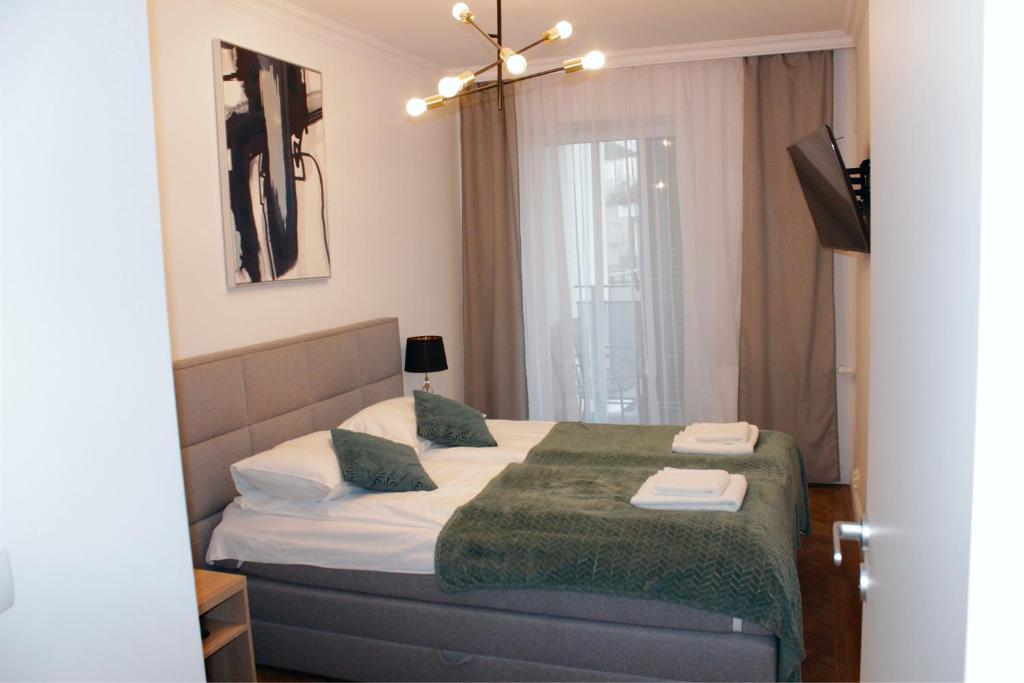 Un pat sau paturi într-o cameră la Bawarczyków